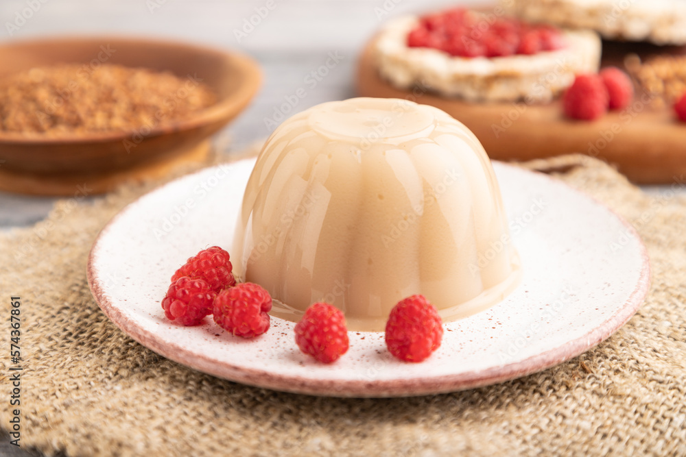Buckwheat milk jelly on gray wooden, side view, selective focus. Stock