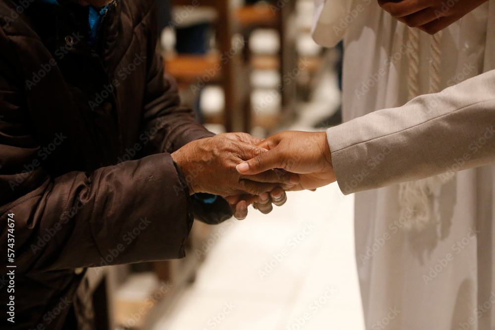 Obraz premium Saint Denis church, Dugny. Peace gesture during mass. France.