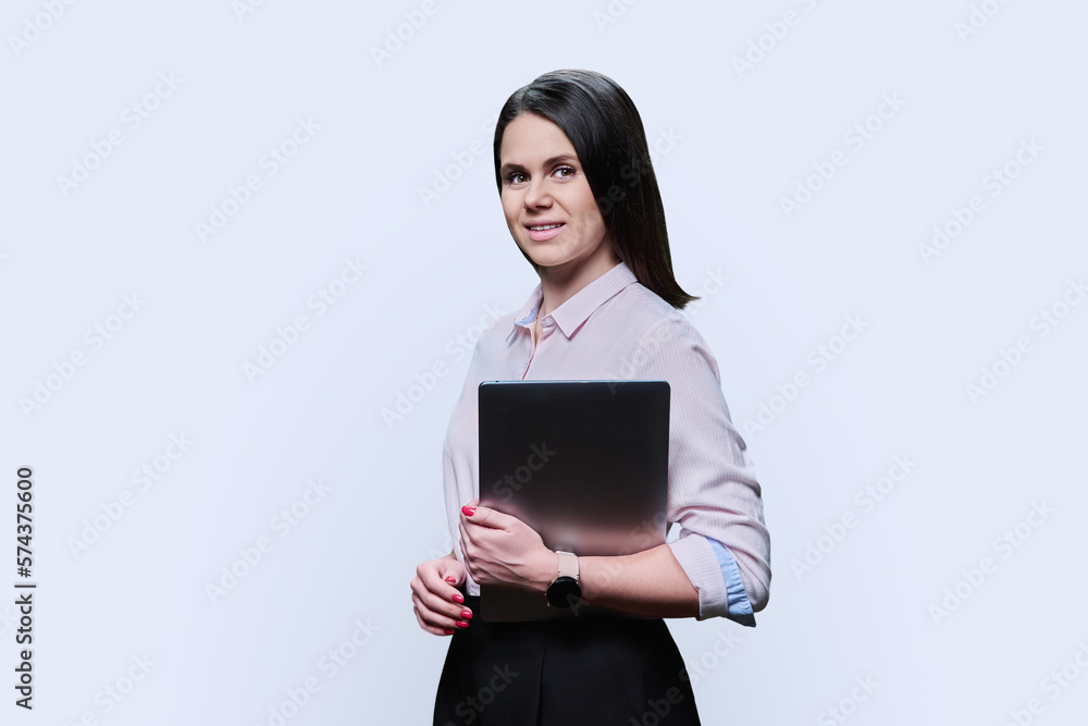 Portrait of young woman with laptop on white background Portrait of young woman with laptop on white background