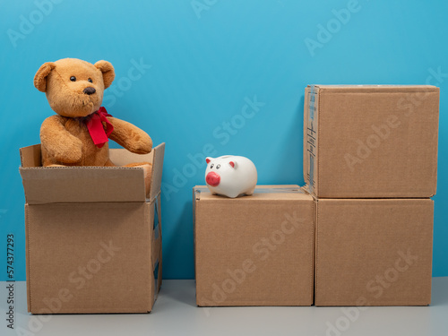Humanitarian aid. Cardboard boxes with donations on a blue background. Close-up. © Jakob