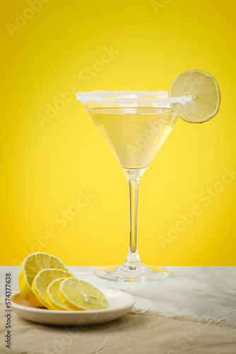 Lemon drop martini coktail garnished with lemon. Martini alcoholic cocktail or non-alcoholic mocktail. Martinis.