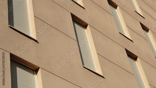 facade background with windows with shutters