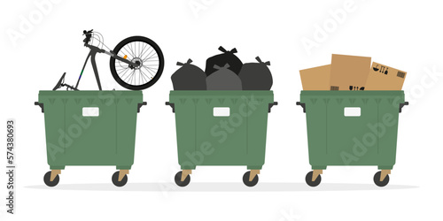 Three trash cans, one with a bike, one with trash bags, and one with cardboard boxes