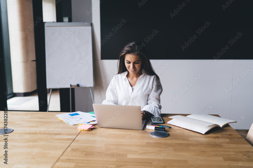 Woman working on laptop in office Woman working on laptop in office