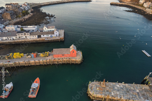 Aerial Drone image of the beautiful fishing and lobstering port of Rockport Massachusetts on a fall autumn day with the lobster boats in the harbor