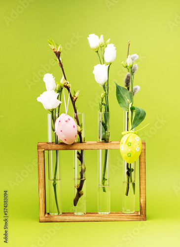 Easter festive composition with beautiful flowers in glass vases