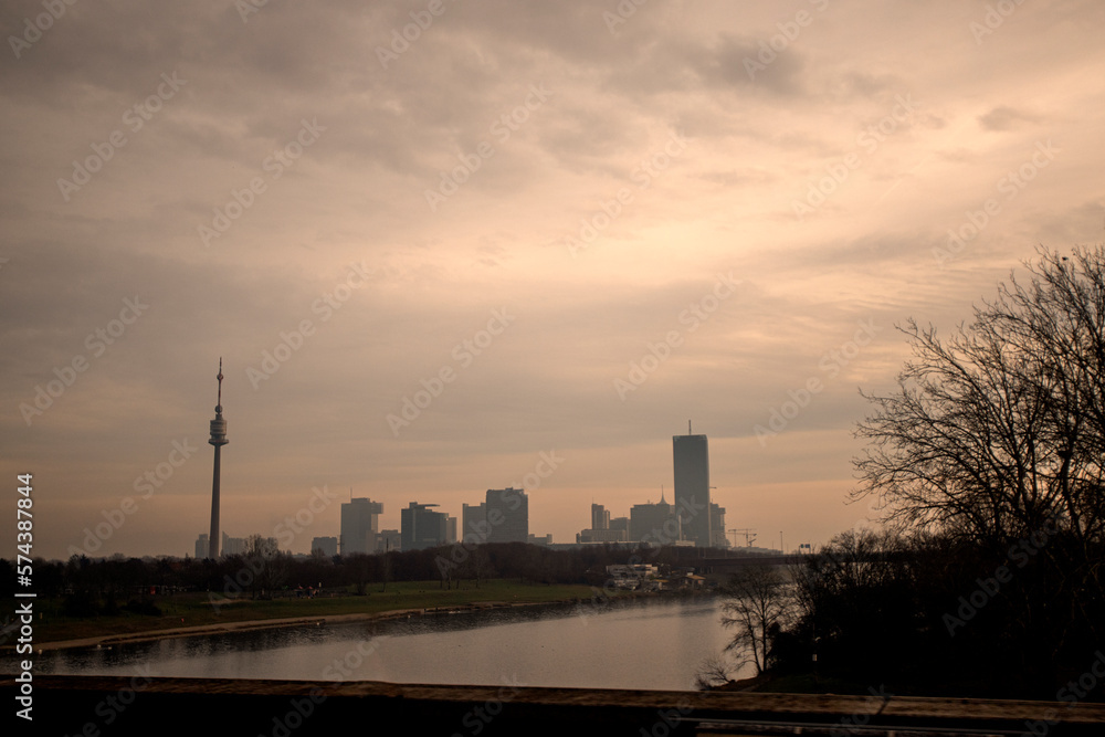 Photograph of the TV tower and Danube river in Donaustadt district, Vienna, Austria in a cloudy day.