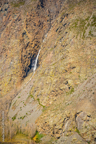 View from mountain pass Katu-Yaryk of waterfall, which falls from a cliff in, Altai, Russia