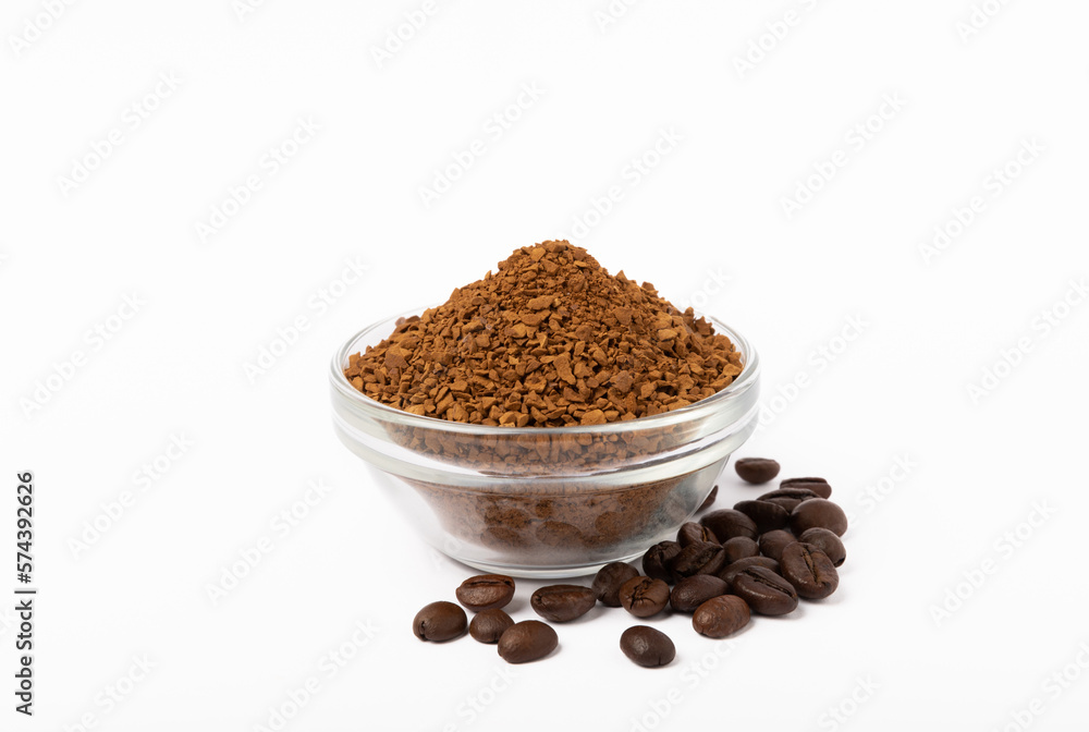 Instant coffee grains in a glass bowl isolated on white background. Instant coffee grains in a glass bowl isolated on white background.