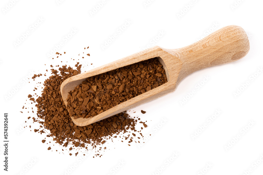 Soluble coffee grains in a wooden spoon isolated on a white background. Soluble coffee grains in a wooden spoon isolated on a white background.