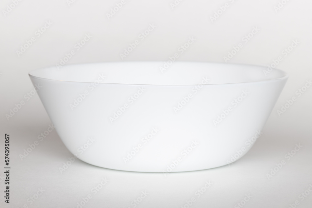 Empty white bowl on a white background. Empty white bowl on a white background.