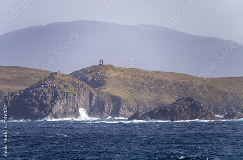 Monument on cliffs by Cape Horn depicts albatross in flight photo