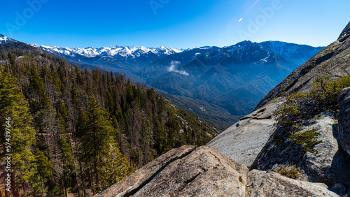 panorama of mountains in sequoia national park seen from moro rock; spring panorama of unique mountains with large sequoia trees