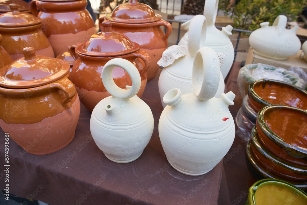 Closeup of some botijos and ceramic jugs in a traditional market