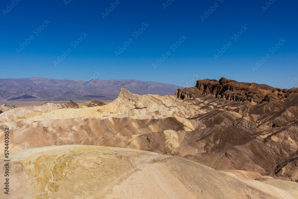 Fototapeta premium Badlands view from Zabriskie Point. Zabriskie Point is a part of the Amargosa Range located east of Death Valley in Death Valley National Park in California, USA.