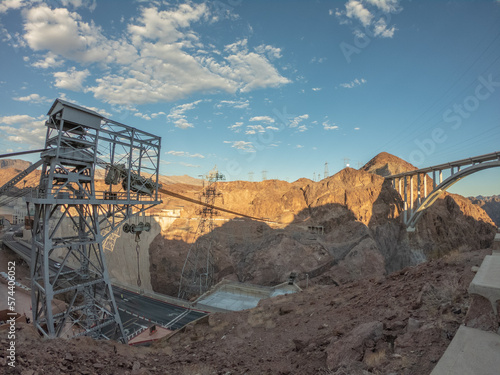 Hoover Dam is a concrete arch-gravity dam in the Black Canyon of the Colorado River, on the border between the U.S. states of Nevada and Arizona. photo