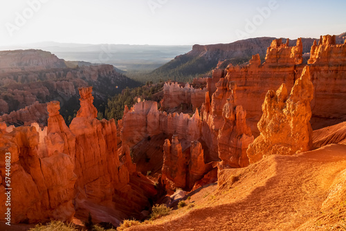 Panoramic morning sunrise view on sandstone rock formation of Thor hammer on Navajo Rim trail in Bryce Canyon National Park  Utah  USA. Golden hour colored hoodoos in unique natural amphitheatre