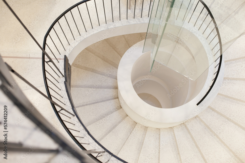 Fototapeta premium modern spiral staircase in office building. abstract architecture background