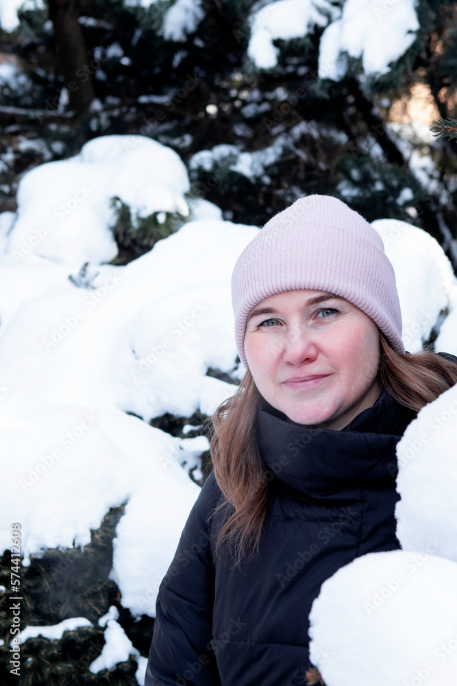 portrait of a girl in a snowy park in winter portrait of a girl in a snowy park in winter