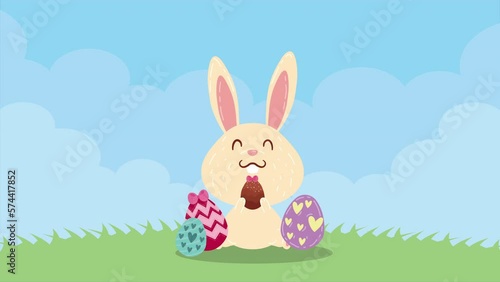 spring eggs painted with rabbit in the field