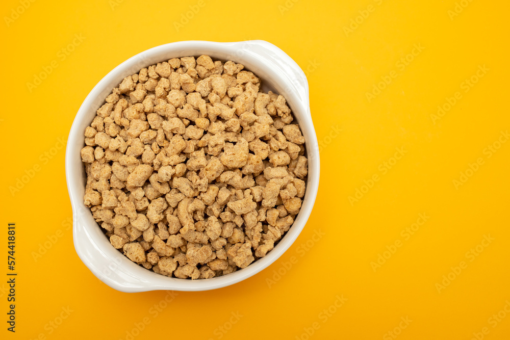 dry uncooked soya in white small bowl dry uncooked soya in white small bowl