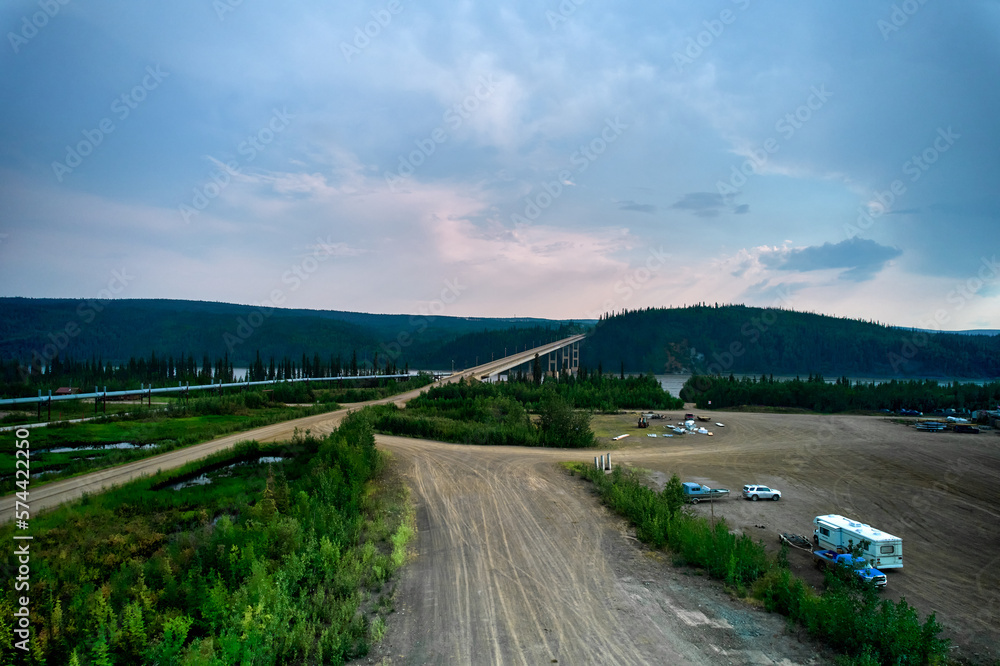 View of the Yukon River Bridge looking south bound with the Alaska Oil Pipeline running parallel with the road way from an aerial drone View of the Yukon River Bridge looking south bound with the Alaska Oil Pipeline running parallel with the road way from an aerial drone