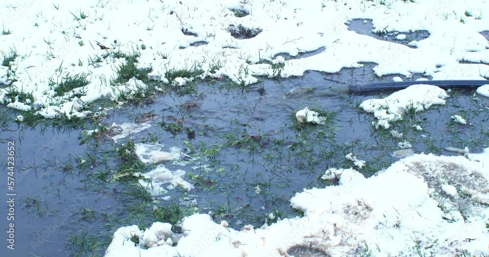 The village sewer drains to the ground from a pipe. Pumping the village sewer to the ground outside the yard. Drainage of domestic water into the soil. The village sewer drains to the ground from a pipe. Pumping the village sewer to the ground outside the yard. Drainage of domestic water into the soil.