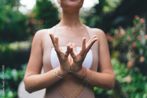 Tableau sur toile Crop woman practicing lotus mudra