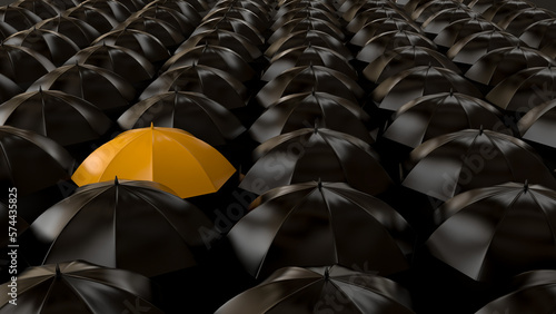 Foto Yellow umbrella among dark ones
