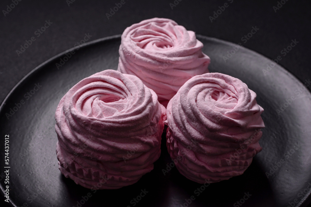 Delicious fresh natural airy marshmallows on a black ceramic plate Delicious fresh natural airy marshmallows on a black ceramic plate