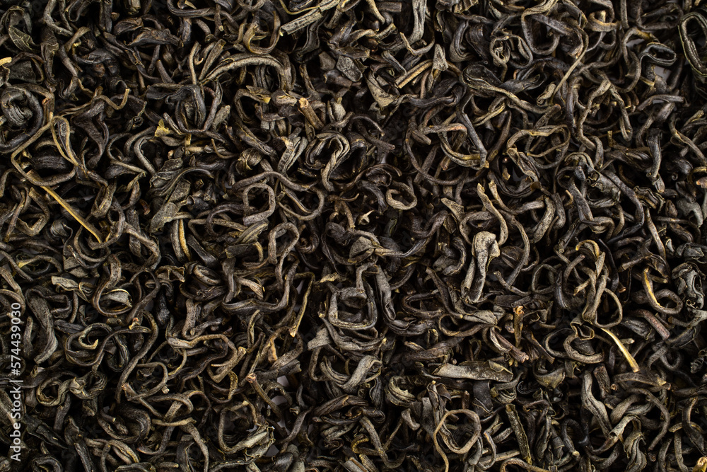 Close up Chinese green leaf tea. Dried tea leaves, top view. Macro Close up Chinese green leaf tea. Dried tea leaves, top view. Macro