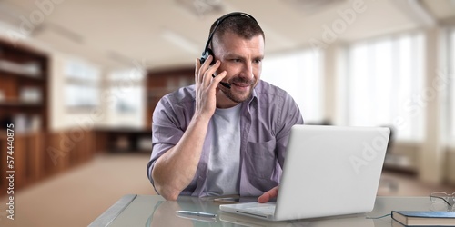 Smiling young business man employer in office