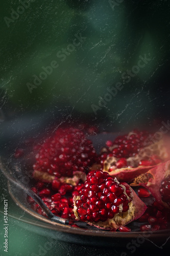 Fresh ripe pomegranate on dark background