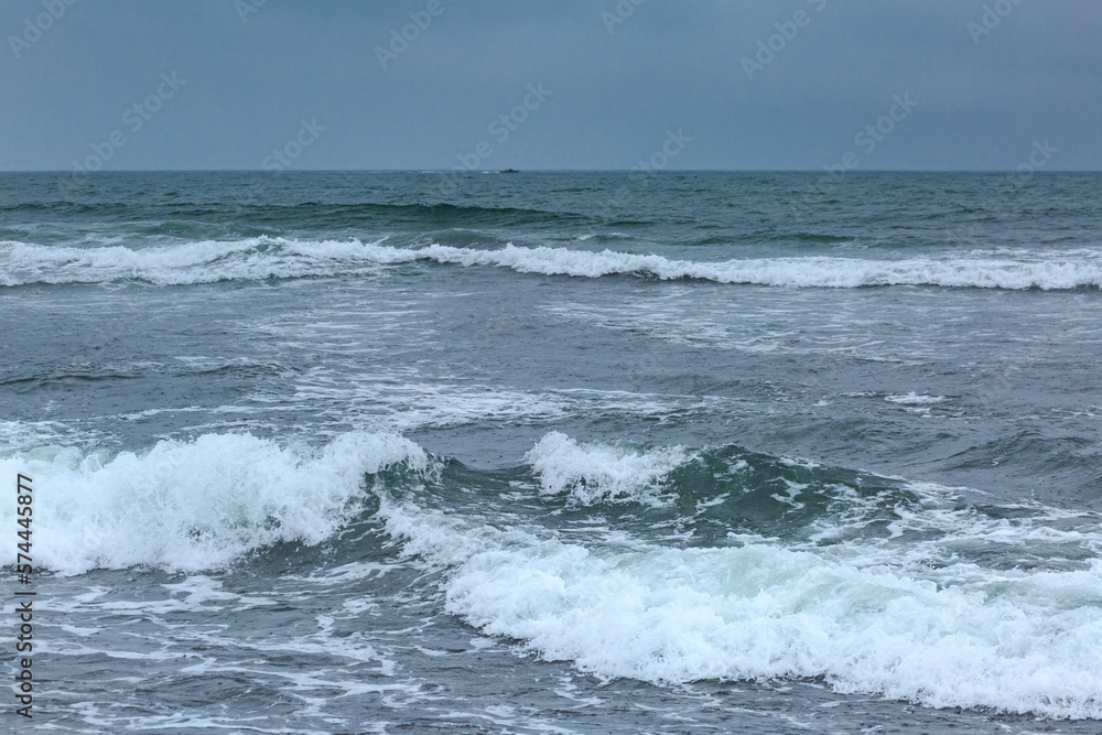 Waves of the Pacific Ocean, coast, rain, cloudy weather, Kamchatka, water.