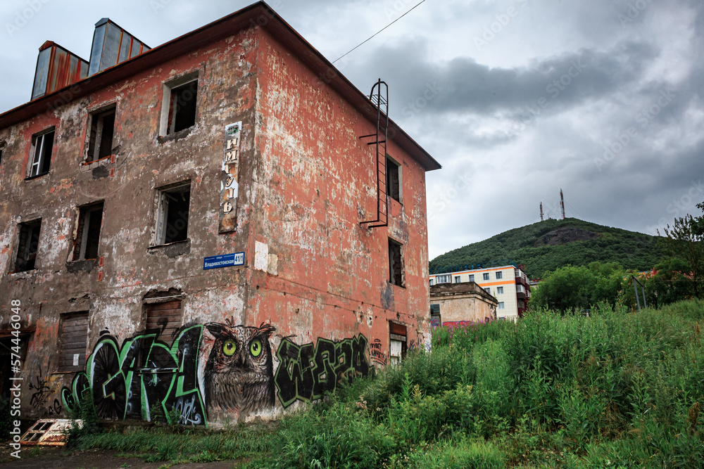 A ruined building in Kamchatka against the backdrop of a mountain, a house without windows. A ruined building in Kamchatka against the backdrop of a mountain, a house without windows.
