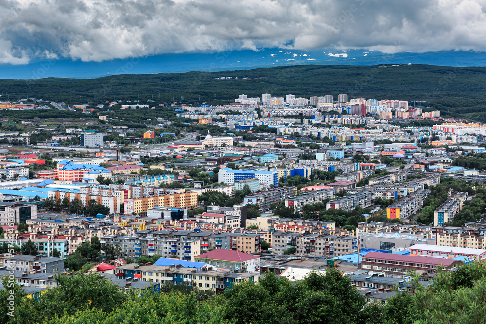 Kamchatka, city, houses, against the backdrop of mountains, clouds.