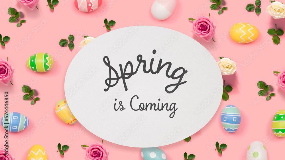 Spring is coming message with Easter eggs on a pink background Spring is coming message with Easter eggs on a pink background