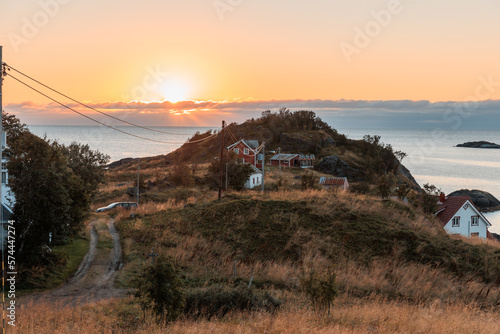 Obraz na płótnie Sunset in Norway with little house and powerline w salonie