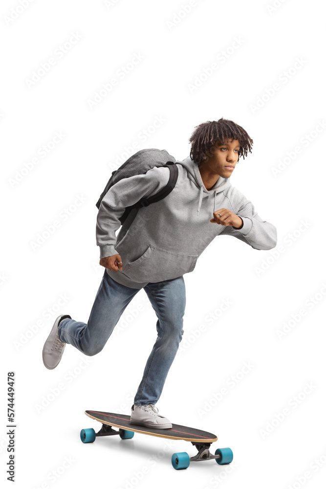 Fototapeta premium African american guy with a backpack riding a longboard