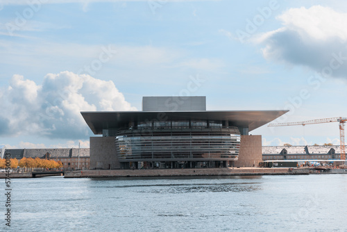 Copenhagen Opera House with river in front of blue sky