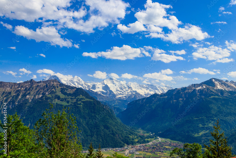 Breathtaking aerial view of Interlaken and Swiss Alps from Harder Kulm viewpoint, Switzerland Breathtaking aerial view of Interlaken and Swiss Alps from Harder Kulm viewpoint, Switzerland
