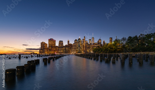Beautiful Sunset and Lower Manhattan skyline with East River and New York City. Twilight with Reflections © Mindaugas Dulinskas