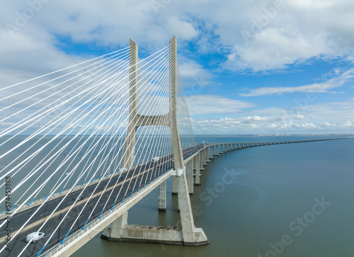 Fototapeta Naklejka Na Ścianę i Meble -  Vasco Da Gama Bridge in Lisbon, Portugal over the Tagus River. Drone Point of View