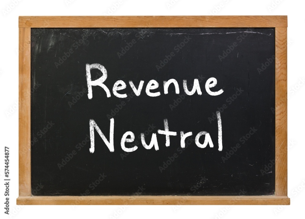 Revenue neutral written in white chalk on a black chalkboard isolated on white