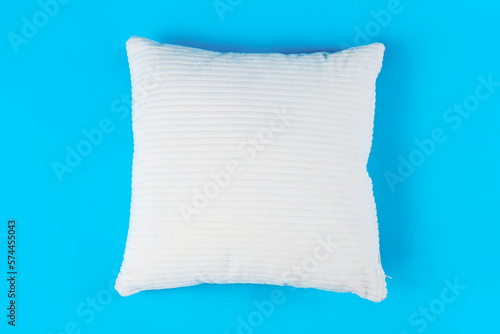 Soft pillow on blue background