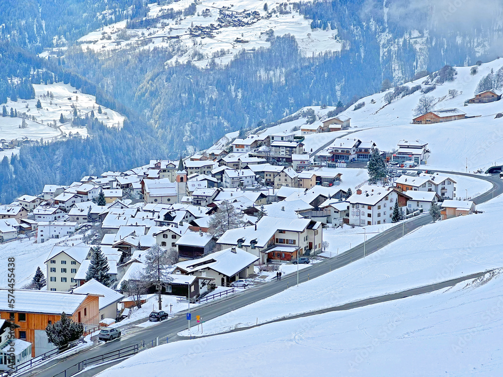 Winter panorama with a fairytale view of the snow-covered alpine village of Lain in the municipality of Vaz-Obervaz in the Albula Region - Canton of Grisons, Switzerland (Schweiz)