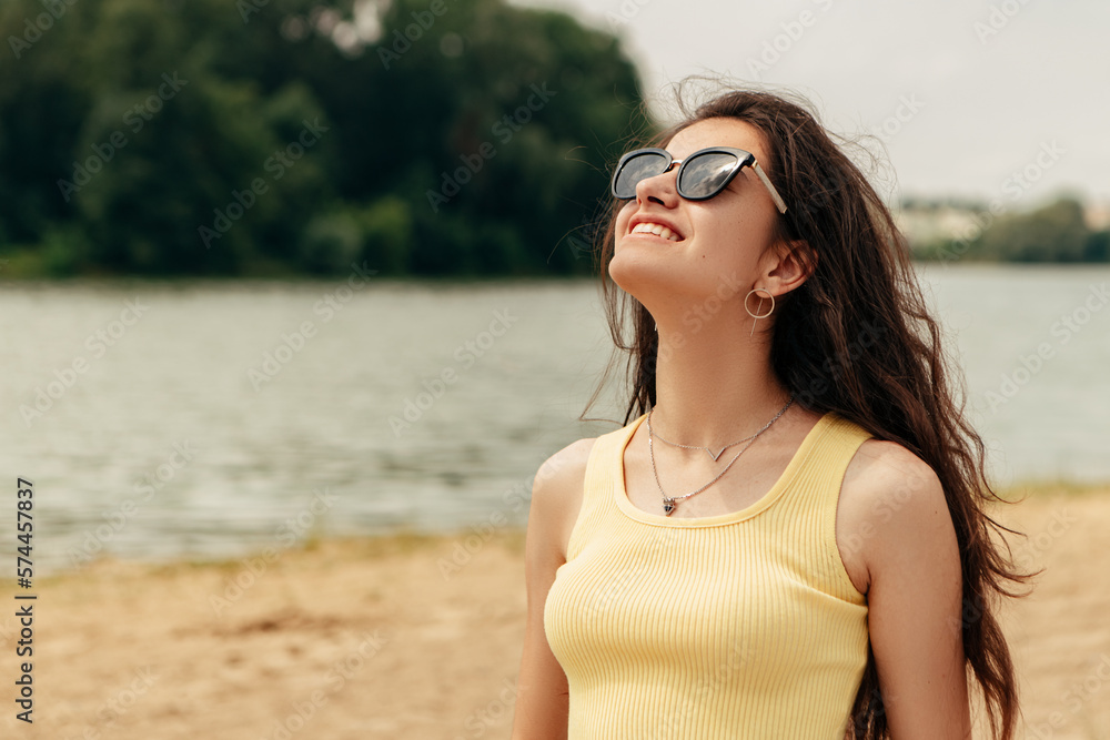 Slim woman stand on the sand near river sea lake. Female on beach island wear sunglasses. Girl tourist on vacation, weekend relaxing resting resort. Lady go on shore, sunbathing
Slim woman stand on the sand near river sea lake. Female on beach island wear sunglasses. Girl tourist on vacation, weekend relaxing resting resort. Lady go on shore, sunbathing