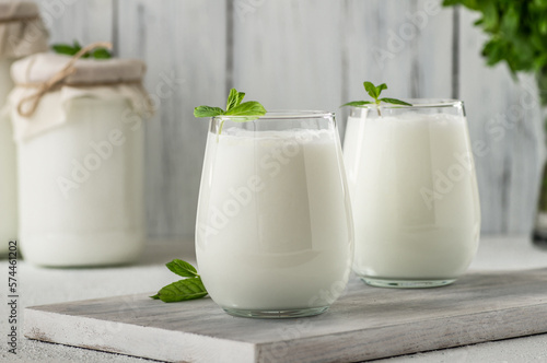 Glass cup of Turkish traditional drink ayran , kefir or buttermilk made from yogurt, healthy food photo