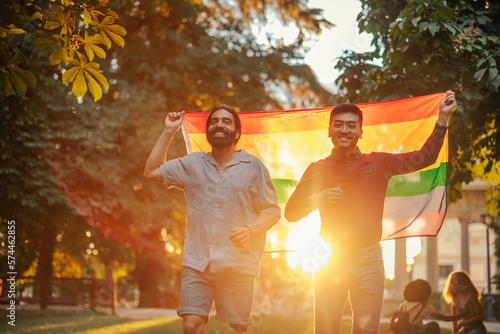 Bisexual couple walking with pride flag