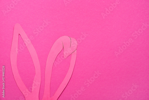 Paper bunny ears on pink background © Pixel-Shot
